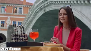 The beautiful girl in a white dress has fun at the pricey masquerade party