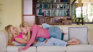 Hot lesbians Nancy and Emma fuck on a green couch