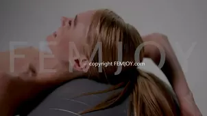 A close up shot of small and pink pussy from a brunette with barely any hair