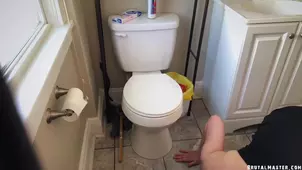 The mistress is being punished for her arrogance in the toilet