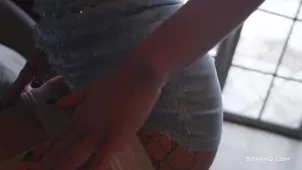 A girl in the bloom of youth undresses for a nicelooking guy