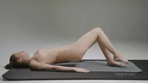 A flexible girl named Alisa I is stretching her sex lips in a captivating image