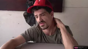 A cute black girl is having fun with her white guy friend in the bedroom