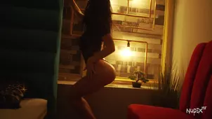A woman displays her erotic charm in a captivating solo performance