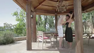 A passionate girl has sex right in the outdoor cabana embodying sensual art